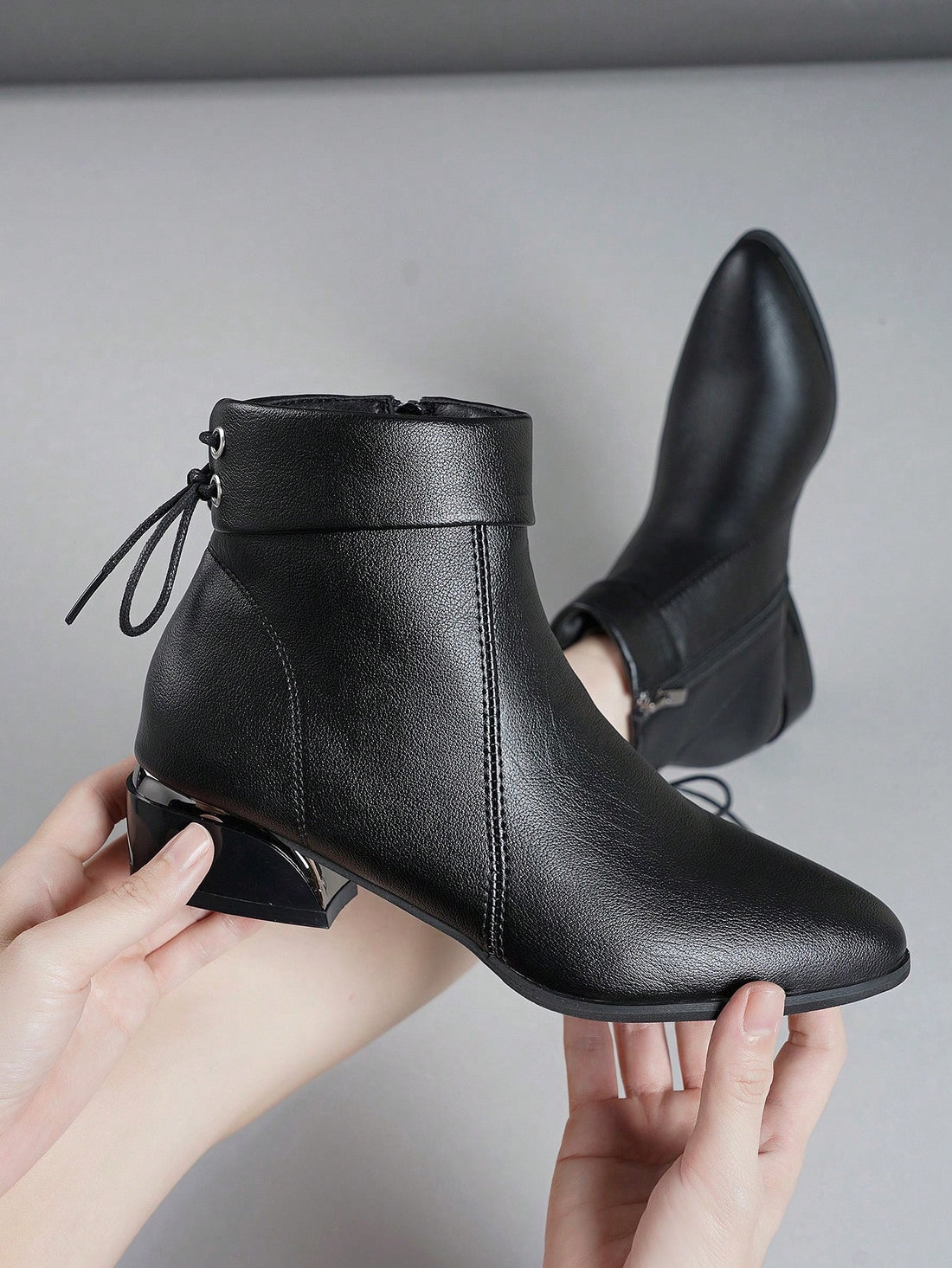 Step out in style with these playful short boots featuring a chic pointed toe and a charming bow detail. The shiny thick heels add a touch of sparkle, while the metal zipper ensures easy wear. Perfect for adding a fun, sophisticated twist to any outfit!