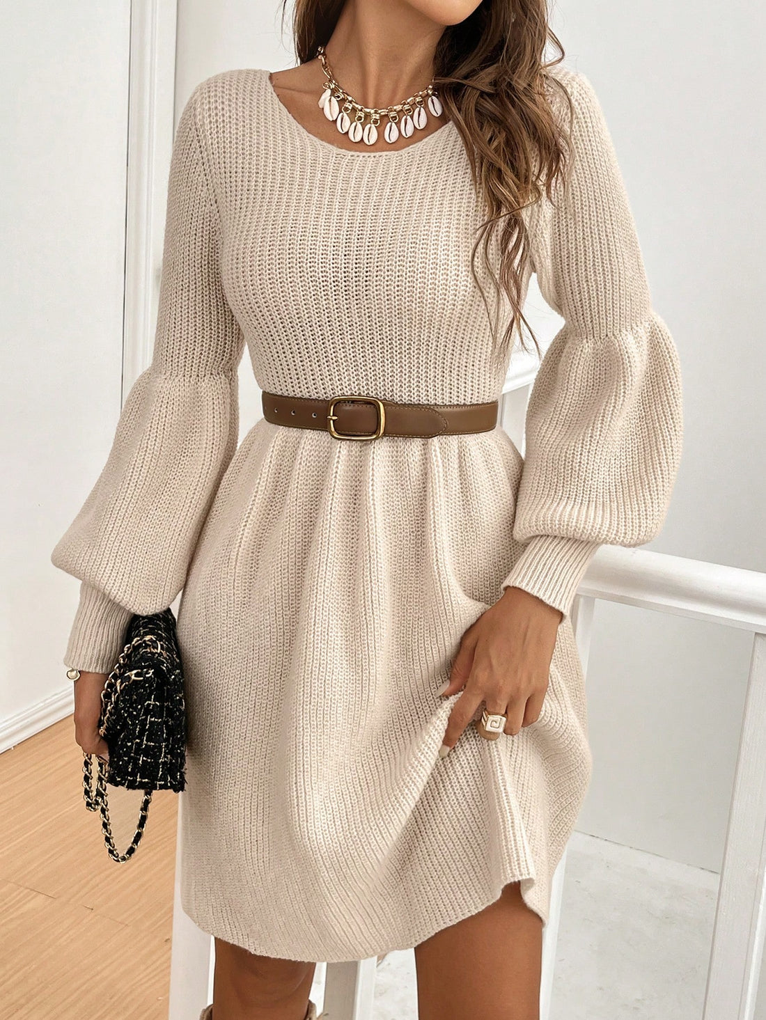 This elegant sweater dress features a stunning hollow back design and delicate lace details. Perfect for the autumn and winter seasons, it exudes a minimalist style that will elevate your wardrobe. Stay warm while looking chic and sophisticated.