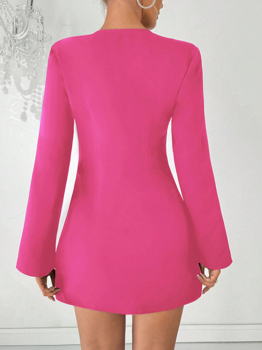 Be the center of attention in this stunning cocktail dress. Featuring a deep V-neckline and flare sleeves, this dress is adorned with elegant rhinestone embellishments that will make you stand out in any crowd. Made with high-quality materials, this dress is perfect for any special occasion.