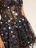 Seated view of black sequin flared mini dress for parties