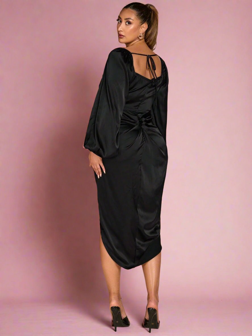 This Elevate Your Elegance maxi dress is perfect for glamorous fall and winter nights. It's made with silky satin and features an asymmetric hem, making it a standout piece in your wardrobe. Plus size options available. Elevate your elegance with this stunning dress.