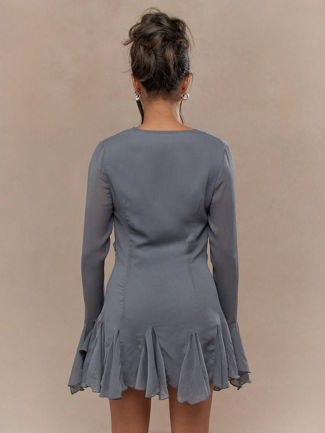 Feel flirty and fun in our Crinkle Chiffon Cowl Neck Mini Dress! With a playful cowl neck and frilly details on the sleeves and hem, this dress is perfect for a night out. Made from lightweight crinkle chiffon, it's both stylish and comfortable. (Plus, no ironing required!)