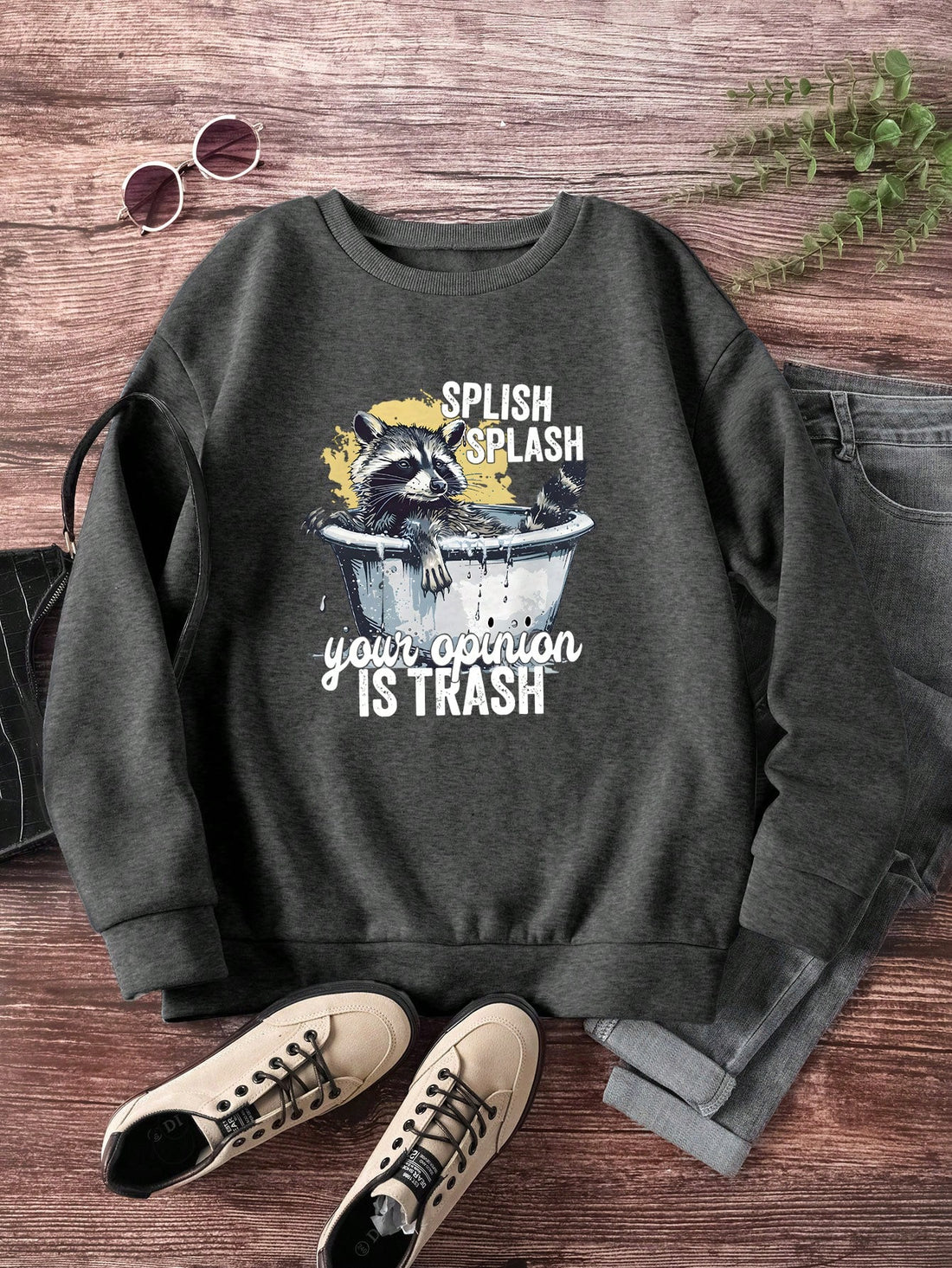 Enhance your autumn wardrobe with our Charming Casual Raccoon Slogan Graphic Sweatshirt. Made with soft and comfortable fabric, this sweatshirt features a charming raccoon graphic and a trendy slogan. Perfect for keeping you warm and stylish during the cooler months.