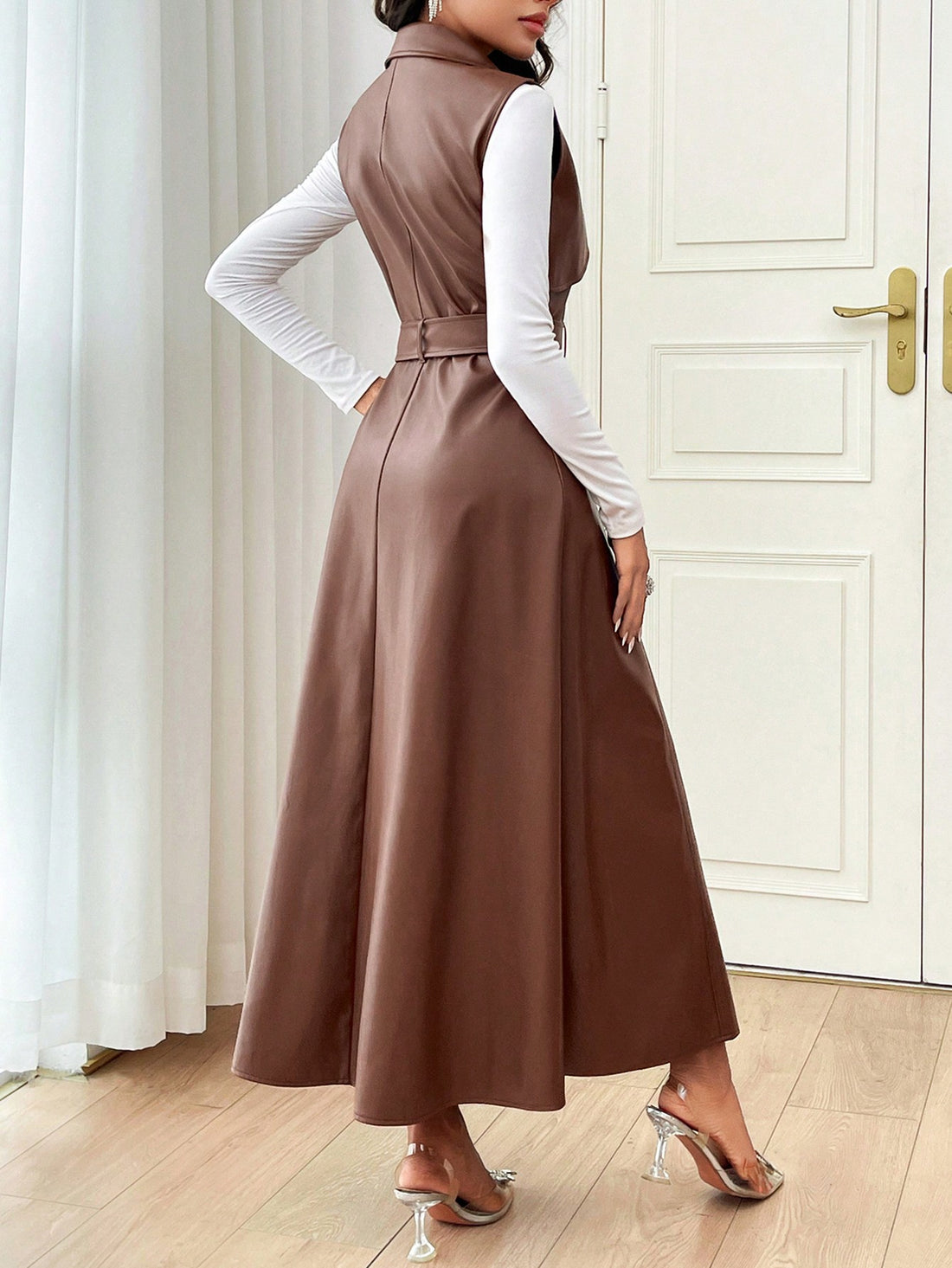 -Expertly crafted with elegant design and front buttons, this sleeveless dress is the perfect addition to your fall wardrobe. -Dress up or down effortlessly with 100% breathable fabric that provides all-day comfort and style.
