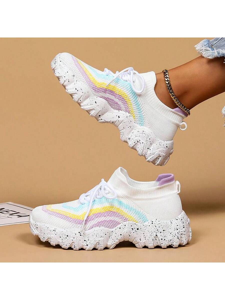 These Vibrant Women's Rainbow Colorblock Sneakers are a must-have for any stylish and active woman. With their vibrant rainbow colorblock design, they are not only fashionable but also versatile for both casual and outdoor activities. Made with high-quality materials, these sneakers offer both comfort and durability. Stand out from the crowd with these trendy and practical footwear options.