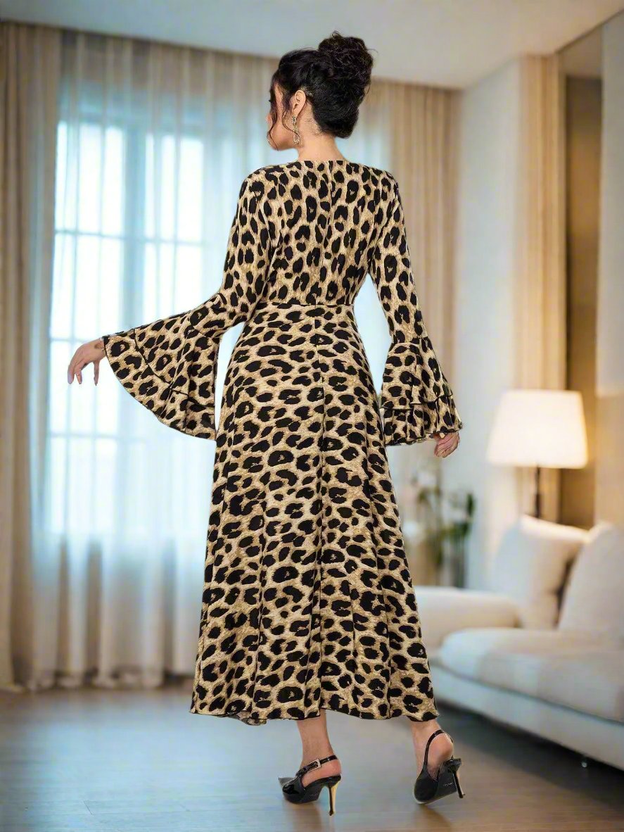 Introducing Wildly Chic: Women's Leopard Print Flared Sleeve Dress. Made with high-quality material, this dress features a trendy leopard print and flared sleeves for a bold and stylish look. Perfect for any occasion, this dress will make you stand out in the crowd. Add a touch of wild to your wardrobe with Wildly Chic.