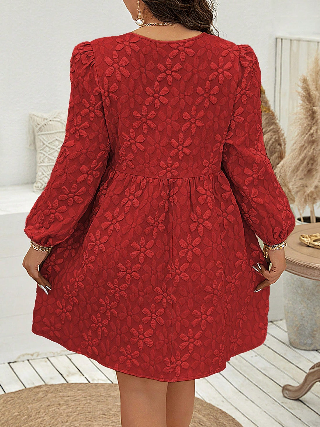 Designed for plus size women, this mini dress features a chic floral print and a lace-up design along with long sleeves. Perfect for any occasion, this dress showcases your curves and enhances your overall style. Made from high-quality materials, it offers both comfort and fashion.