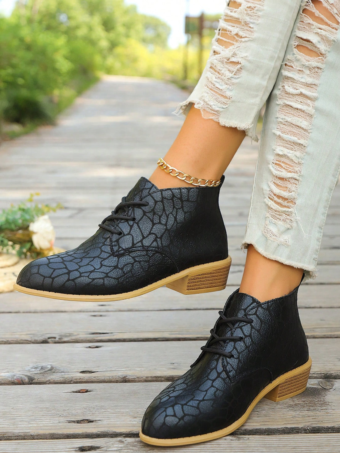 These Chic & Versatile Black Low Heel Lace-Up Boots are the perfect addition to your wardrobe. With a sleek and stylish design, these boots are ideal for both work and autumn-winter style. The low heel provides comfort and the lace-up feature adds a touch of sophistication. Elevate your look with these must-have boots.