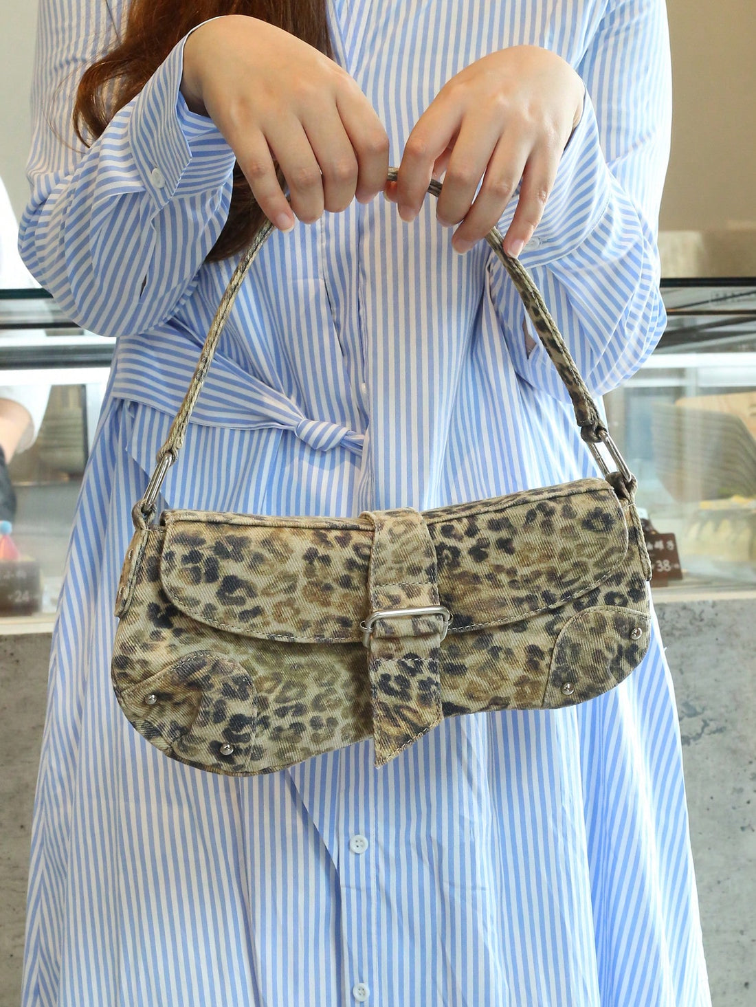 Add a splash of vintage charm to your outfit with this chic silver textured woven clutch purse. Lightweight yet roomy enough for your essentials, it’s the perfect companion for weddings, proms, and parties. Its shimmering woven pattern catches the light just right, making sure you sparkle wherever you go. A playful nod to timeless elegance, this clutch turns every moment into a stylish statement.