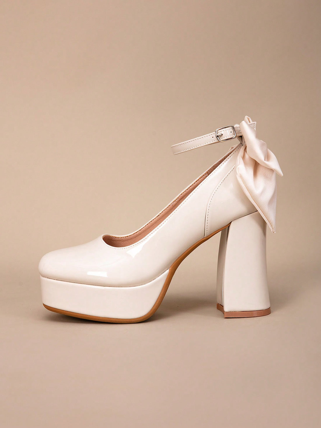 Elevate your look with these Chic Bowknot Peep-Toe Platform Heels. Perfect for parties and weddings, they add a touch of elegance and style to any outfit. The bowknot detail adds a feminine touch while the platform heel provides comfort and stability. Make a statement and stand out at any event with these chic heels.