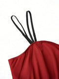 Back close up of burgundy dress bodice with black adjustable spaghetti straps