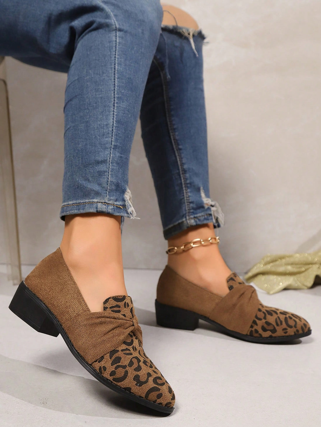 Step into effortless style with these leopard print slip-on flats that blend wild sophistication with everyday comfort. The charming bow detail and pointed toe silhouette add a touch of playful elegance to any outfit, while the slip-on design keeps you moving through your day without missing a beat. Perfect for commuting, casual outings, or whenever you want to look put-together without the fuss. These versatile flats transition seamlessly across seasons, making them the go-to shoe that works as hard as you