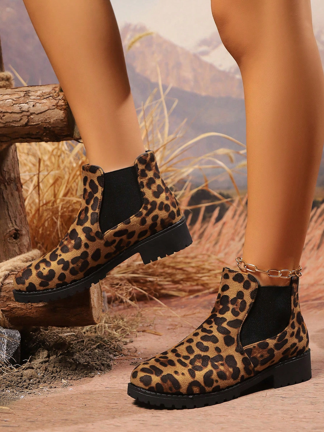 Elevate your style with these Chic Leopard Print Chelsea Ankle Boots. The chunky sole and retro design offer effortless fashion, while the leopard print adds a touch of wild to your ensemble. Perfect for making a statement and standing out from the crowd.