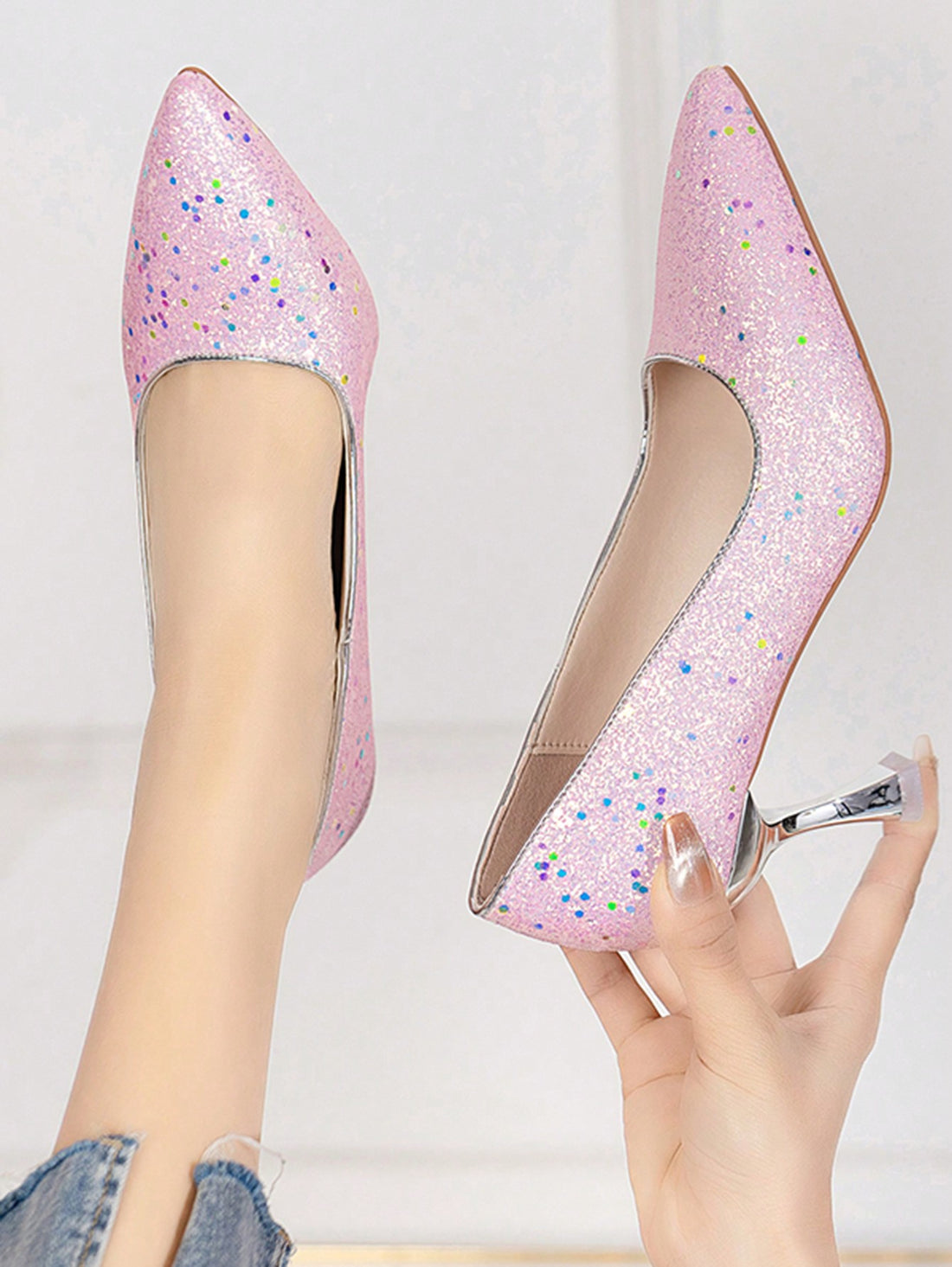 Indulge in Effortless Glam with Sparkling Elegance's Women's Pointed Toe Sequin Stilettos. These stilettos feature a sparkling sequin design, adding a touch of luxury to any outfit. The pointed toe style elongates the legs while the stiletto heel provides a sleek and elegant look. Elevate your style with these glamorous stilettos.