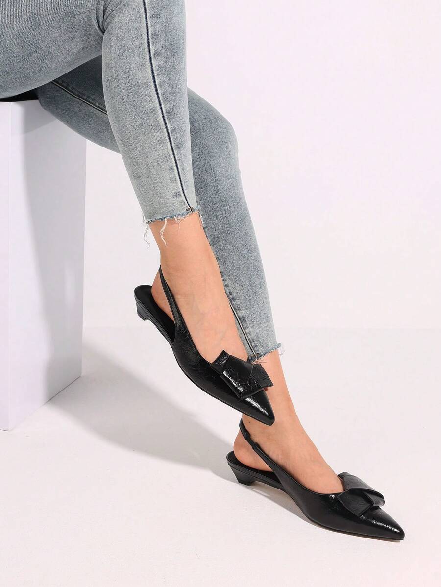 Step into charm and grace with these playful kitten heels! Featuring an elegant bow knot and a pointed closed toe, these slingback pumps add a flirty touch to any bridal or wedding look. The modest heel height ensures comfort while giving you just enough lift to dance the night away in style. Perfect for making memories with a touch of whimsy!