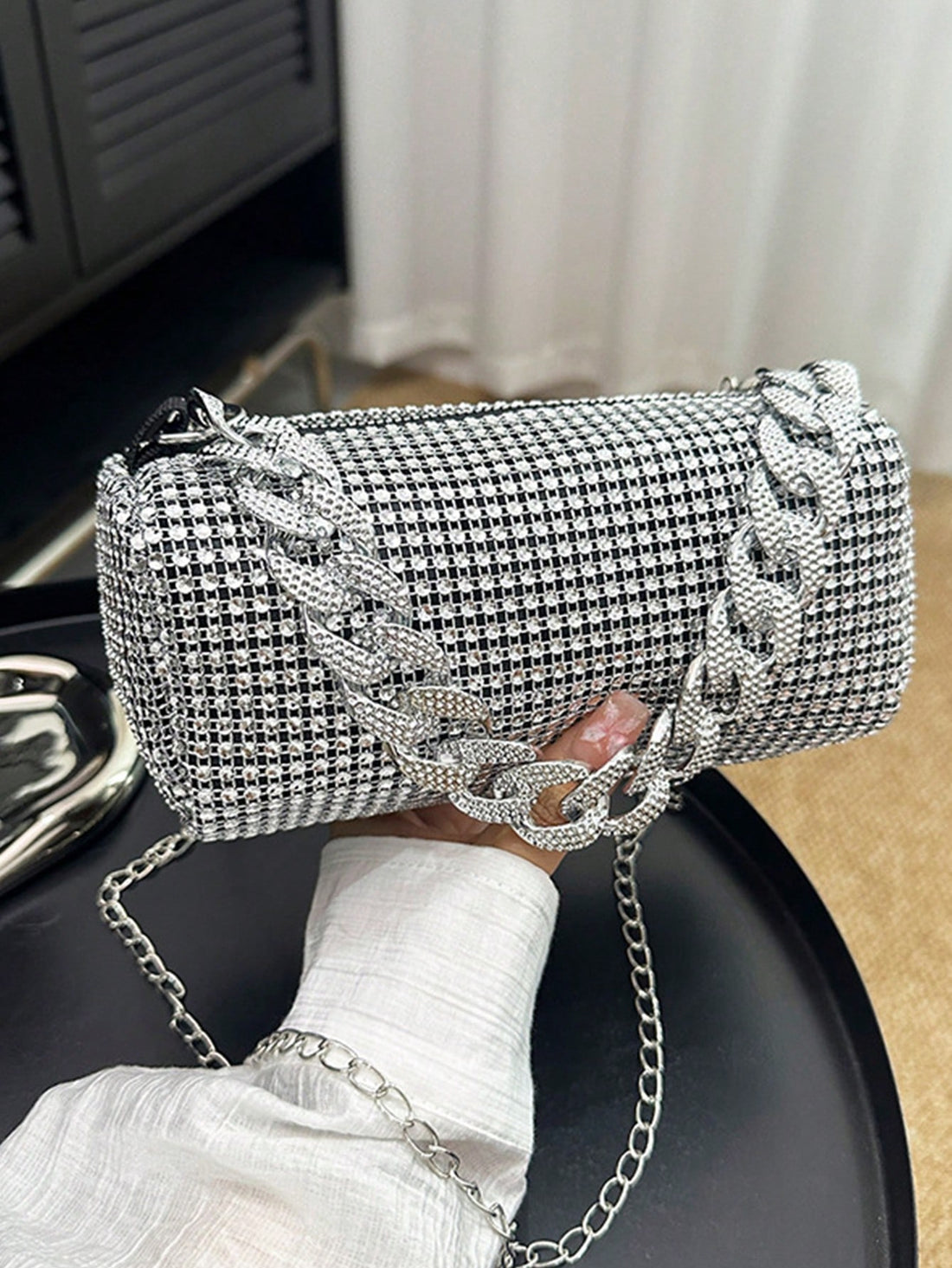 Step out in style with Sparkling Elegance, the perfect bag for glamorous evenings. This exquisite mini bucket bag is studded with rhinestones, adding a touch of elegance and sophistication to any outfit. Elevate your look and make a statement with Sparkling Elegance!