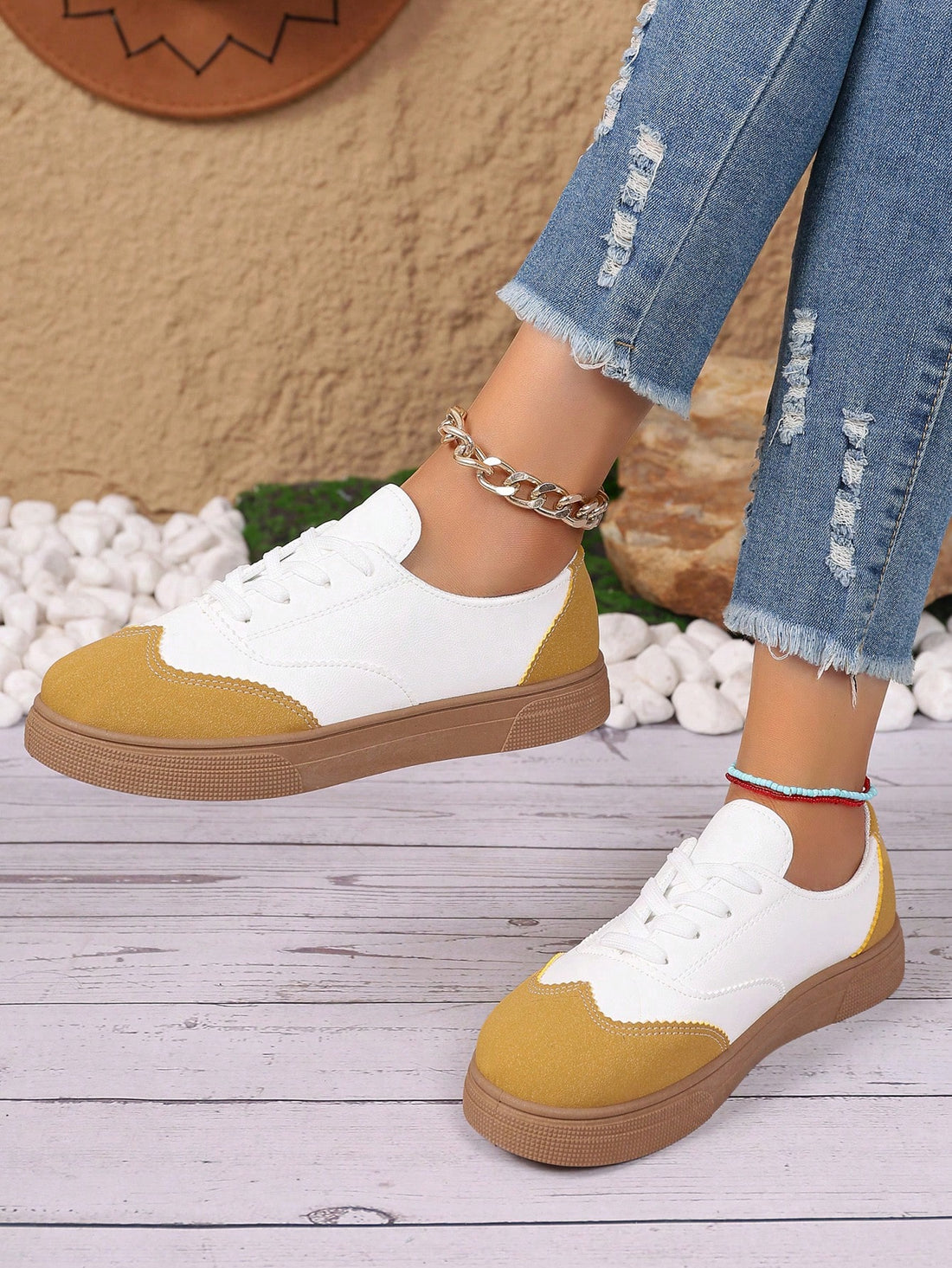 Stay comfortable and stylish for any sport and any season with these lace-up sneakers. The breathable design keeps your feet cool, while the serrated details add a fashionable touch. Versatility meets comfort in this must-have shoe.