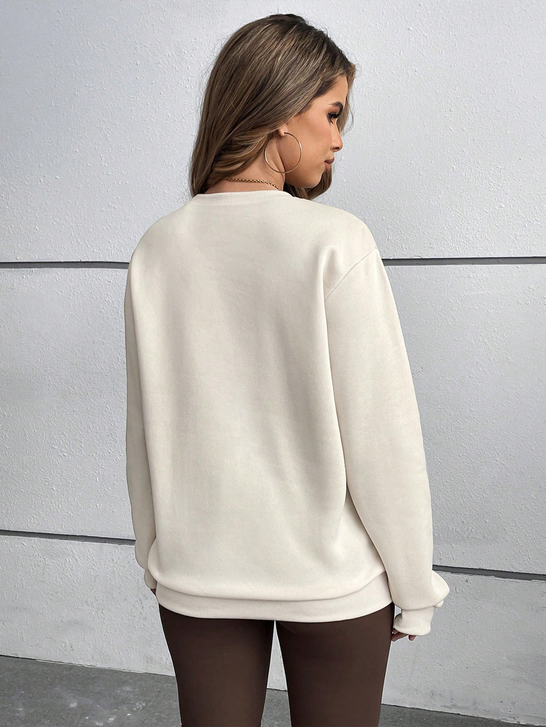 Elevate your wardrobe with the Chic & Comfy Plus Size Sweatshirt. Featuring a minimalist letter print design, this stylish sweatshirt offers both fashion and comfort. Made for plus-size figures, it is perfect for daily wear and easily pairs with any outfit. Upgrade your style with this must-have addition.