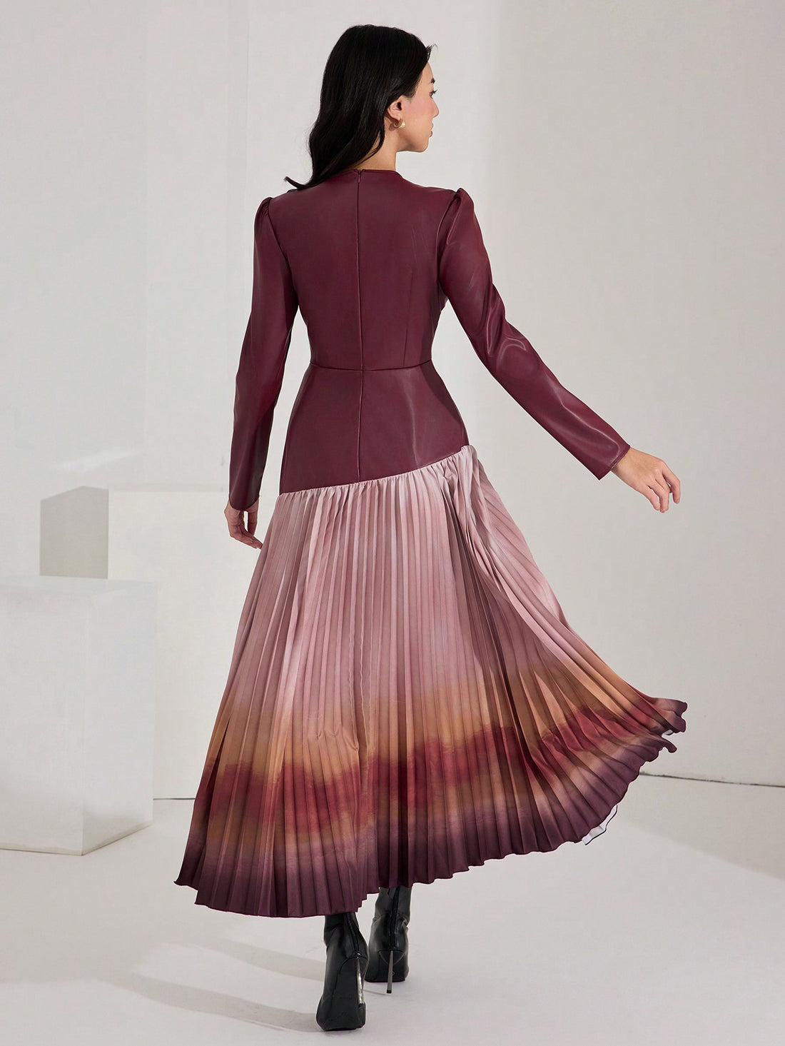 Step into autumn with flair in this Elegant Burgundy Leather Ombre Long Dress. Featuring a mesmerizing ombre effect and playful lantern sleeves, it’s designed to turn heads while keeping cozy. The pleated hem adds a touch of twirl-worthy charm, perfect for dancing through crisp fall evenings. Embrace warmth and style in one unforgettable statement piece.