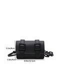 Detail of structured square silhouette on the mini crossbody bag