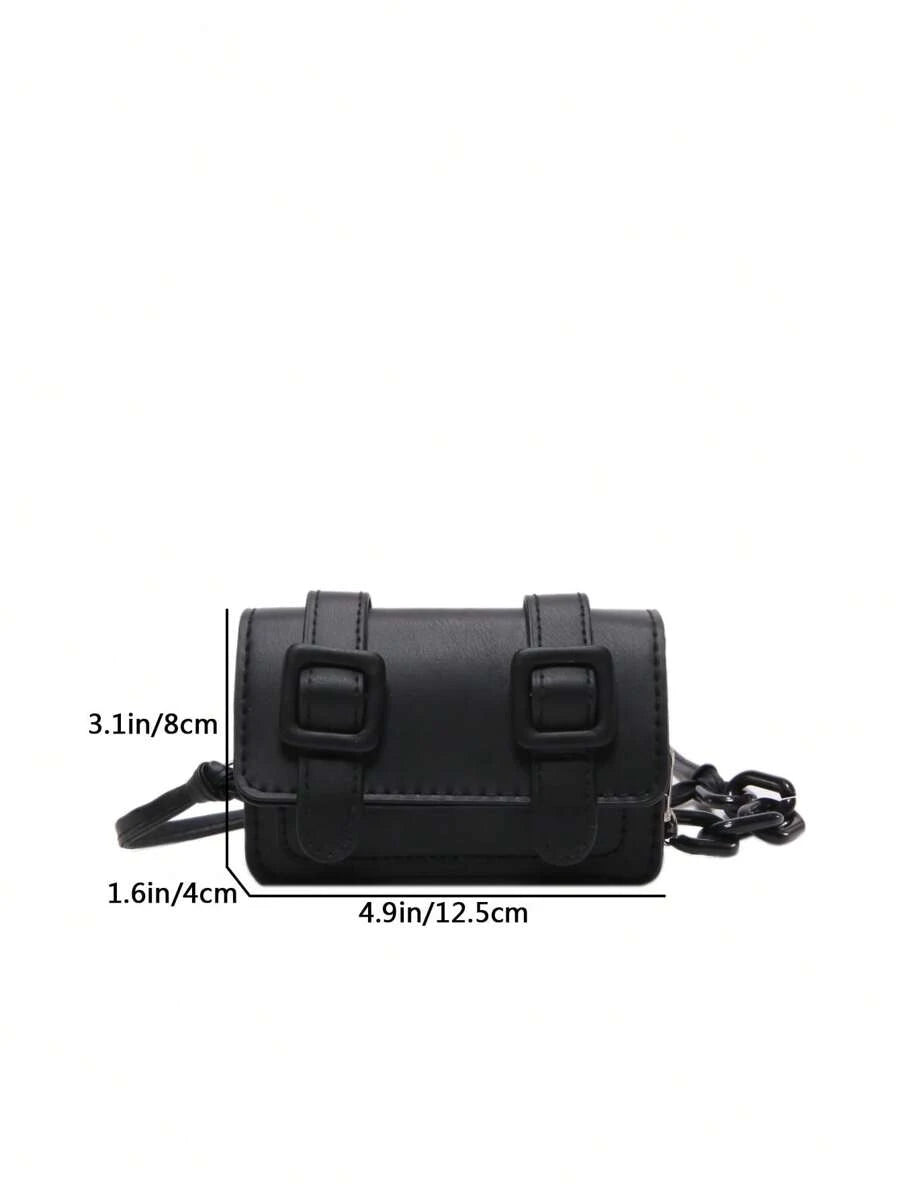 Detail of structured square silhouette on the mini crossbody bag