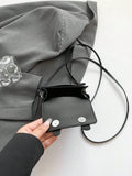 Lifestyle styling of colorful mini crossbody bag with preppy fashion look