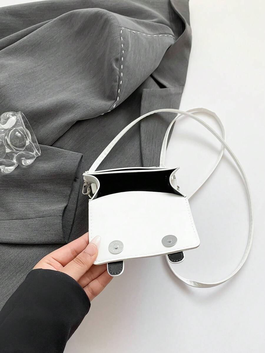 Front detail of multicolor mini acrylic bag with polished finish