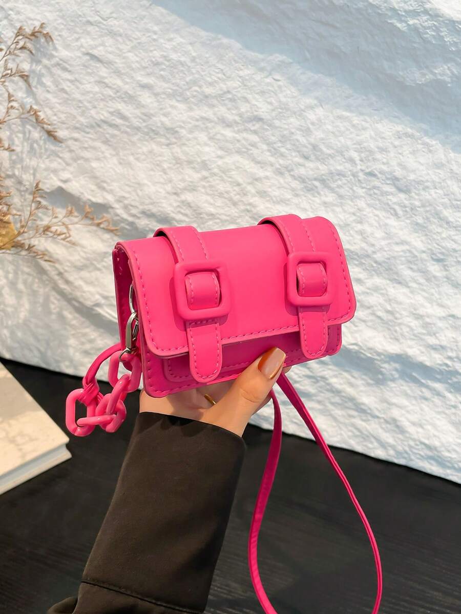 Lifestyle view of mini square crossbody bag paired with casual dress