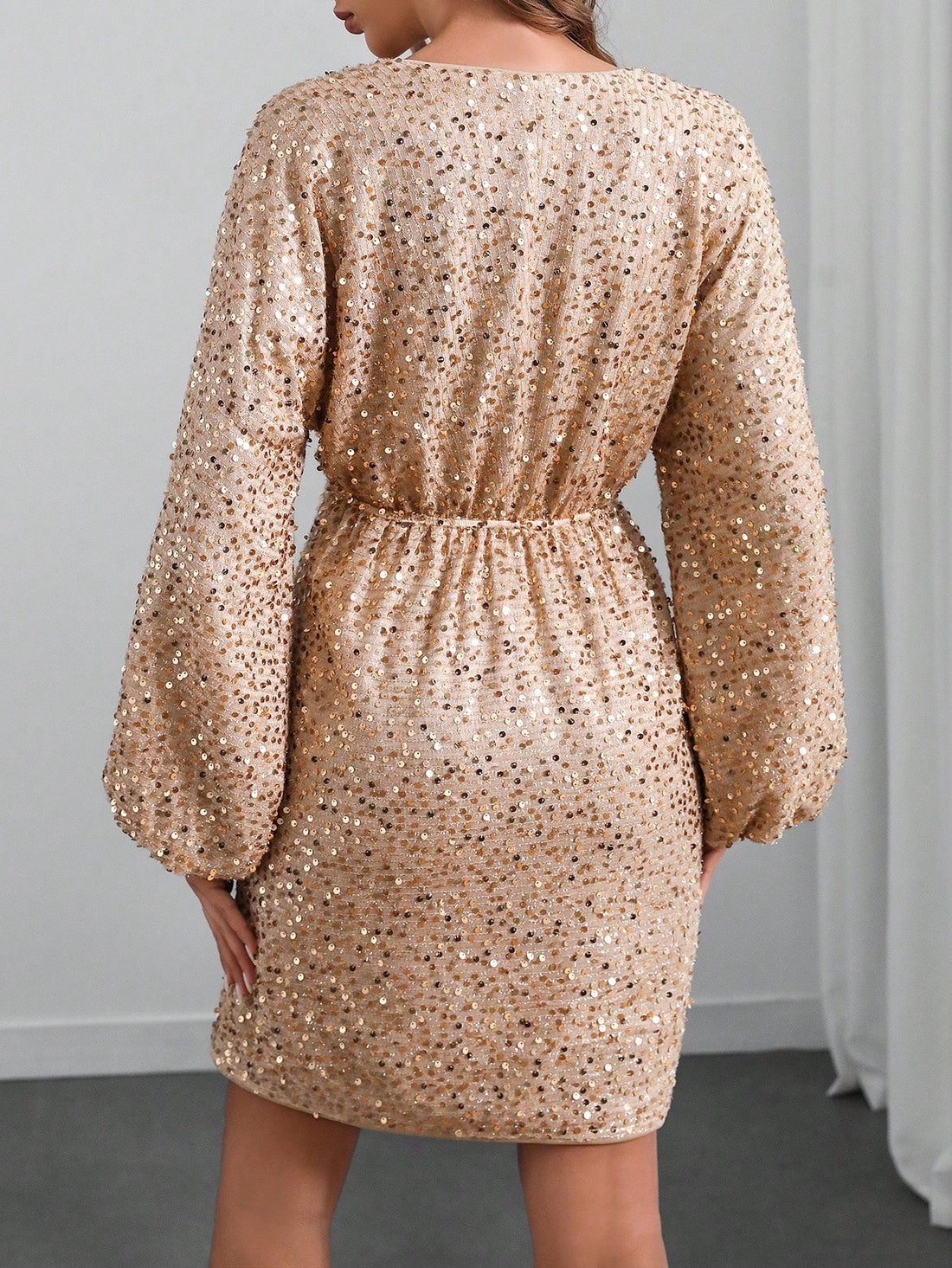 Get ready to dazzle in our Shimmering Elegance dress! With its glitter sequin details and v-neck design, this mini dress is the perfect choice for any party. The batwing sleeves add a touch of elegance and the shimmering fabric will make you stand out from the crowd. Order now and be the star of the show!