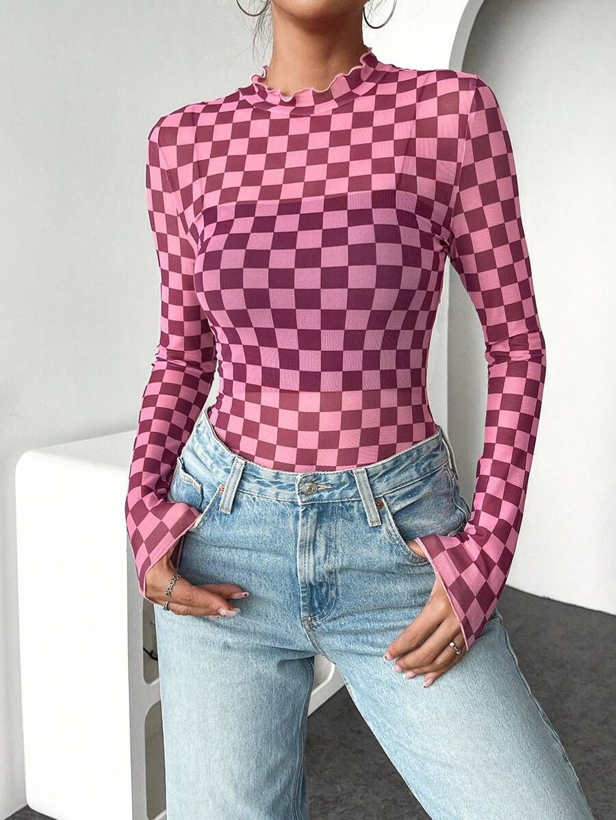 Front three-quarter view of pink and dark berry checkerboard fitted knit top