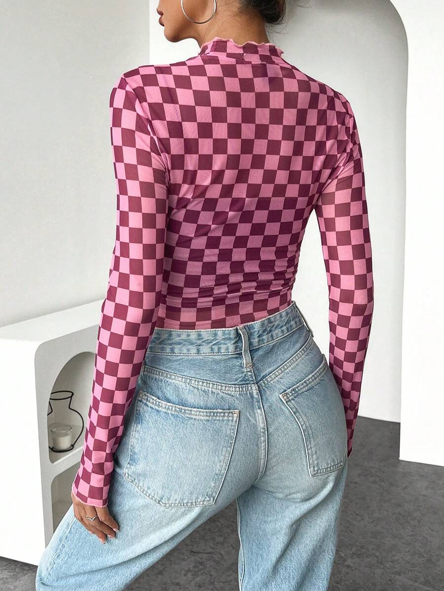 Rear three-quarter view of pink checkerboard long-sleeve shirt with stand collar