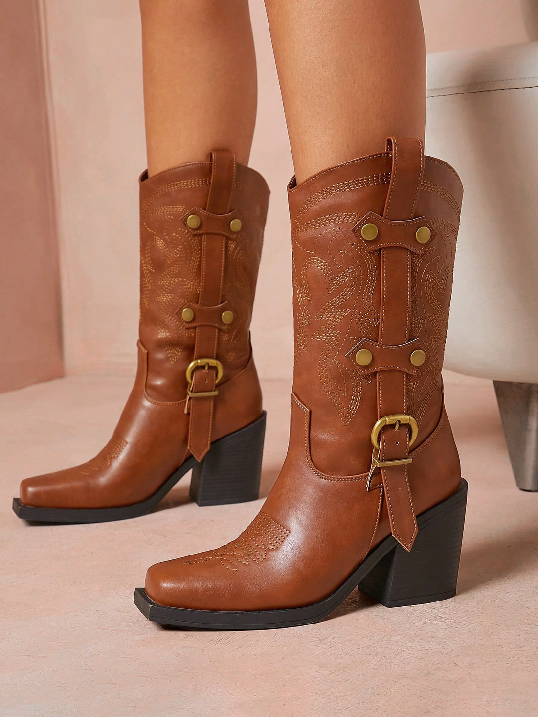 Step into style with these Bold Brown Square Toe Cowboy Boots designed just for women who love a little edge. Featuring a chunky platform and playful straps, these boots bring Western charm to your fall and winter wardrobe. Perfect for adding a confident kick to any outfit, they blend classic cowboy vibes with modern flair. Get ready to turn heads and stomp through the season in comfort and boldness!