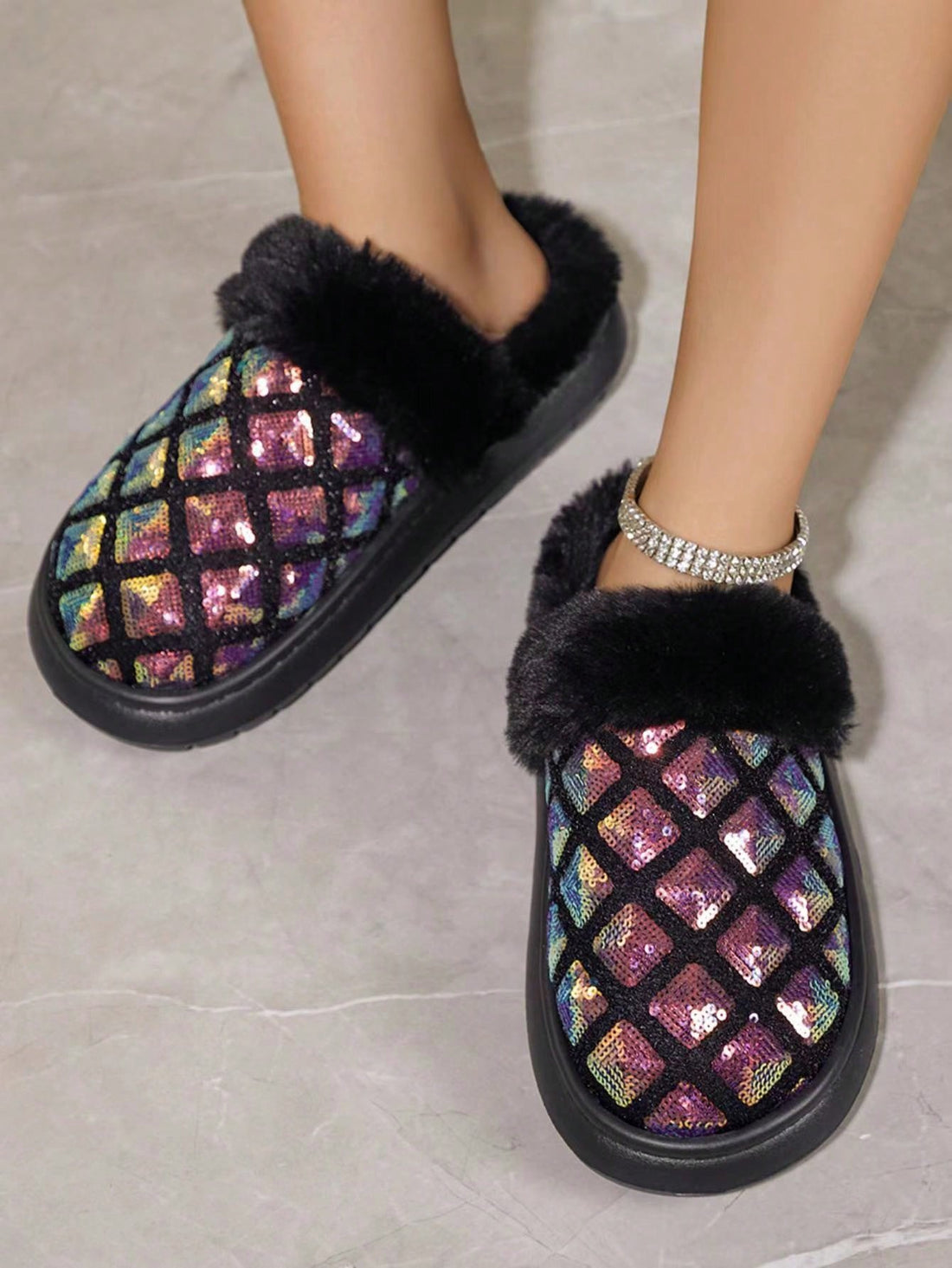 These Sparkling Comfort slip-on house slippers will keep your feet warm and cozy with their warm lining. The glitter-embellished design adds a touch of glamour to your loungewear. Experience comfort and style in these fashionable slippers.