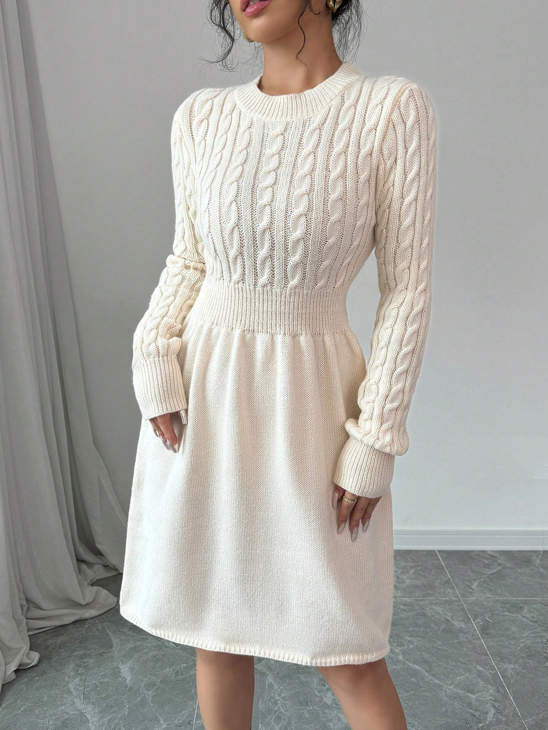 Stay stylish and warm this season with our Chic Autumn & Winter Essential: Solid Color Round Neck Long Sleeve Knit Sweater Dress. Made from high-quality materials, this dress combines fashion and functionality. Perfect for any occasion, it will keep you cozy and elegant all day long.