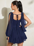 Back view navy mini dress with sheer split puff sleeves open back tie and smocked panel