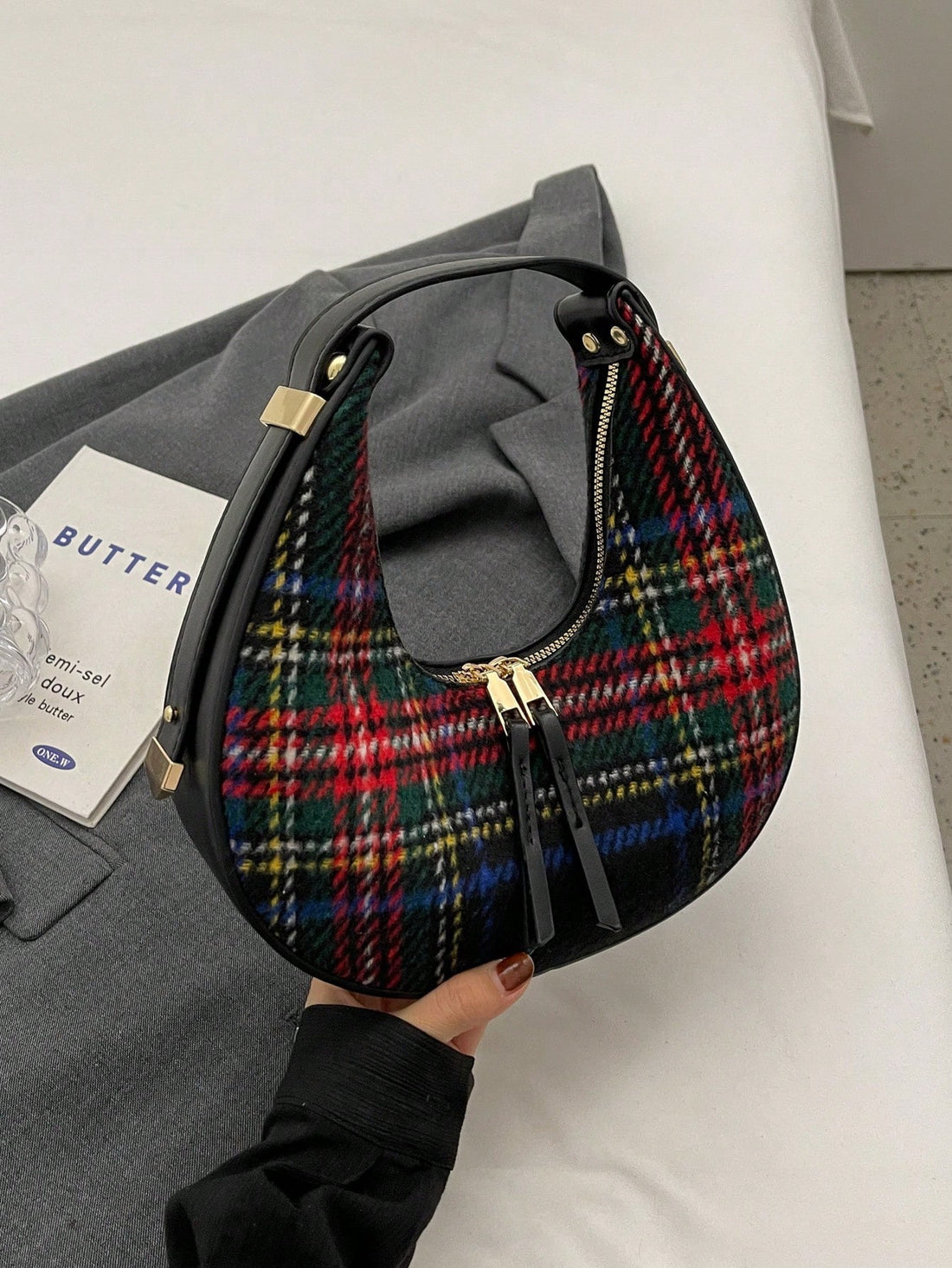 Introducing the Crescent Moon Plaid Armpit Bag, a stylish and versatile fashion statement in coffee! Featuring a dual-color design and trendy plaid pattern, this bag is both practical and eye-catching. Its crescent moon shape adds a unique touch, making it a must-have accessory for any fashion-forward individual.