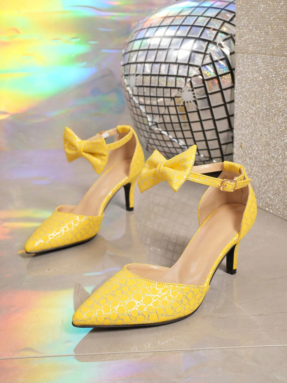 These charming yellow pointed toe shoes feature a high heel and a sweet hollow-out design that adds a feminine touch to any outfit. Made for women, they are perfect for any occasion and are sure to catch the eye of others. Elevate your style with these elegant and stylish shoes.