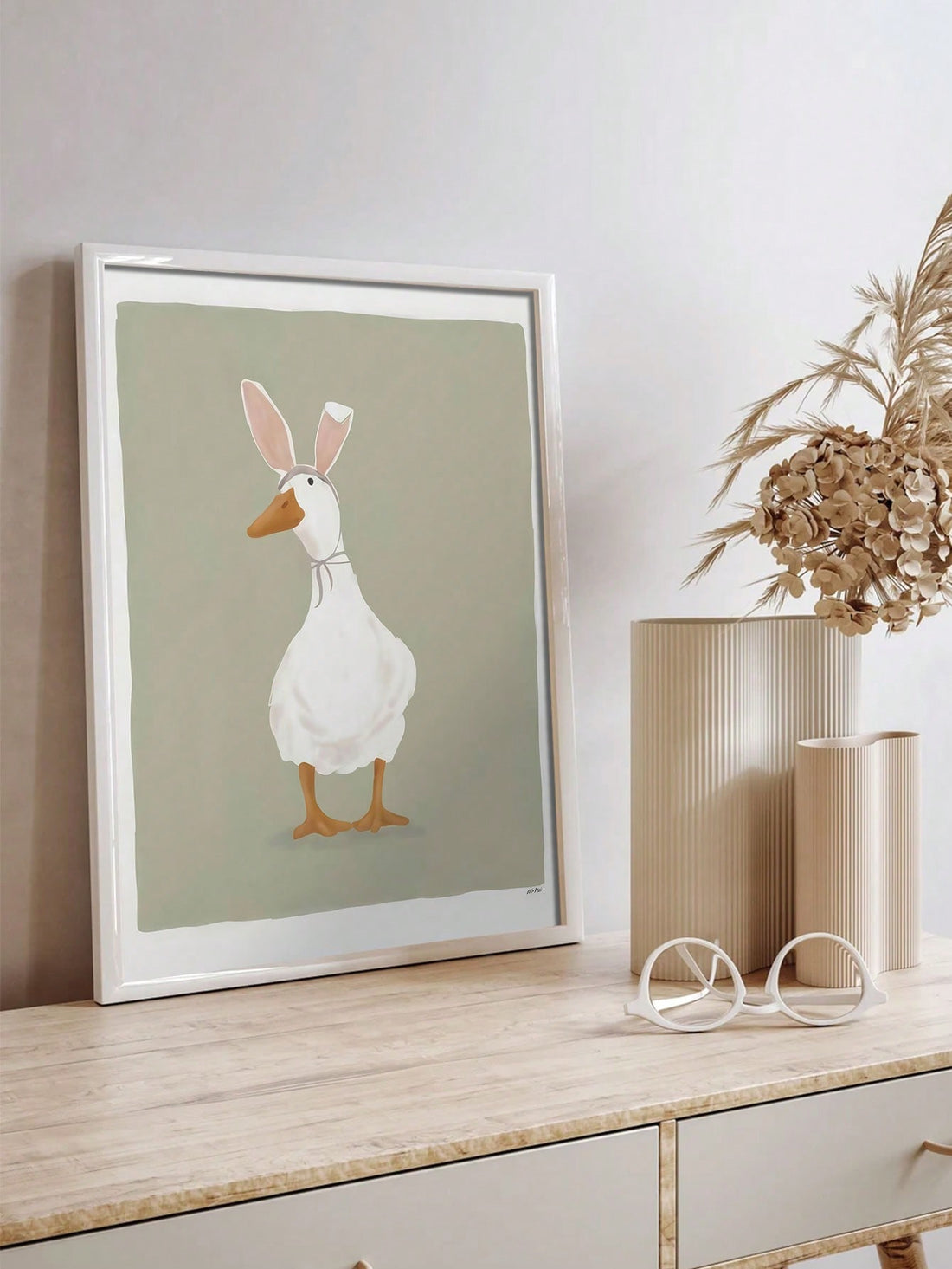 Bring some whimsy to your Easter decor with our vintage unframed canvas wall art featuring a charming duck with bunny ears. This unique piece adds a playful touch to any room and is a must-have for any Easter celebration. Made with high-quality materials, it is sure to last for years to come.