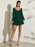 Emerald green chiffon mini dress with sweetheart neckline wrap bodice waist tie and flared ruffle skirt