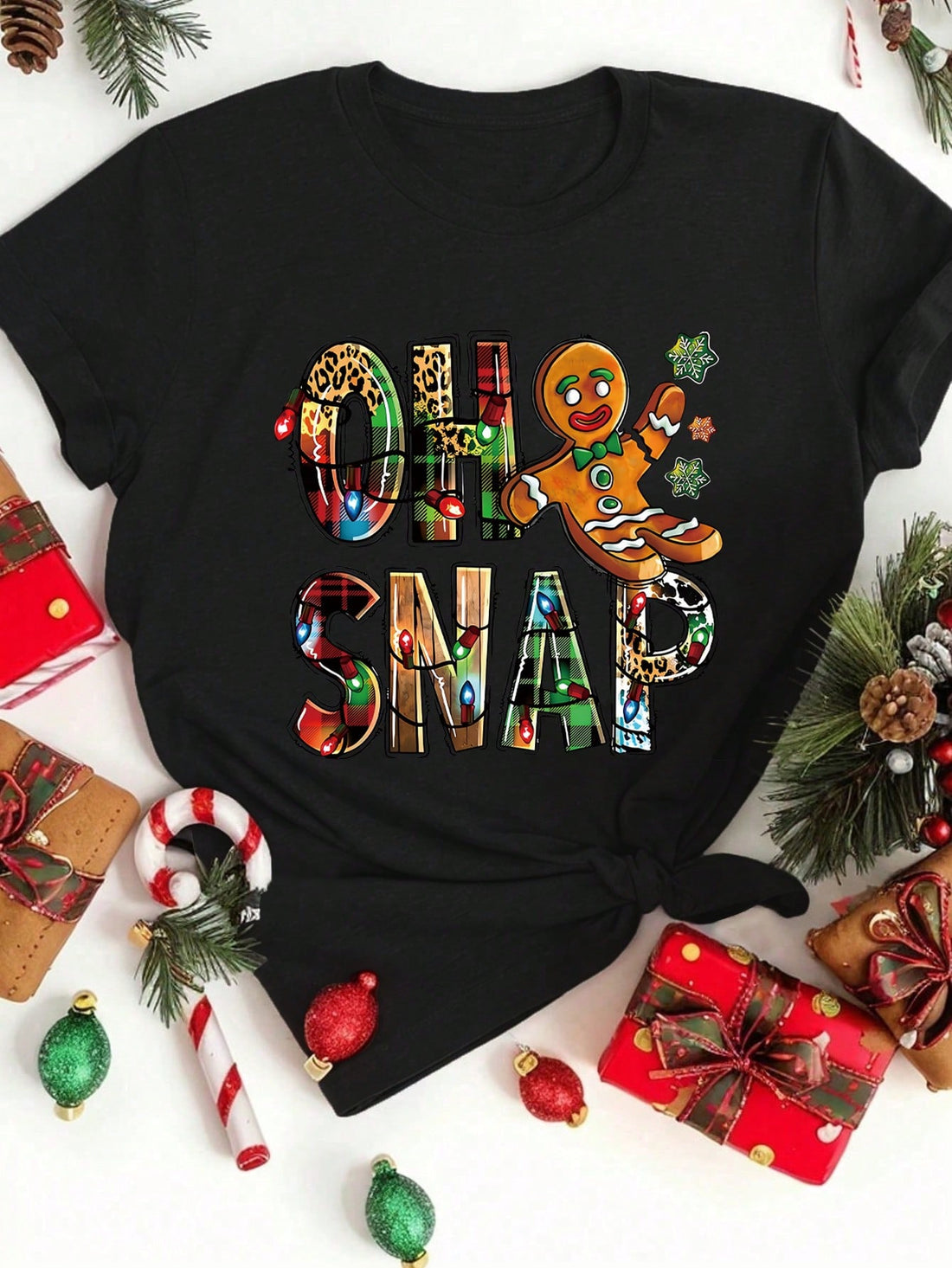 Celebrate the holidays in style with our Festive Gingerbread Man T-Shirt. Made for a comfortable and casual fit, this shirt is perfect for spreading cheer and joy this Christmas. With its classic design and soft fabric, it's the ideal choice for any festive occasion.
