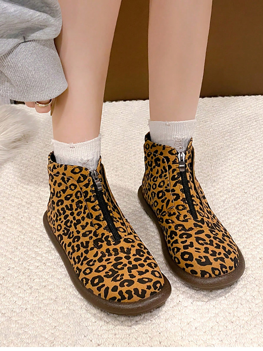 Upgrade your footwear collection with our chic plus size British ankle boots! Featuring a stylish leopard print design and comfortable flat design, these boots are perfect for any occasion. Elevate your style game with our trendy and functional boots.
