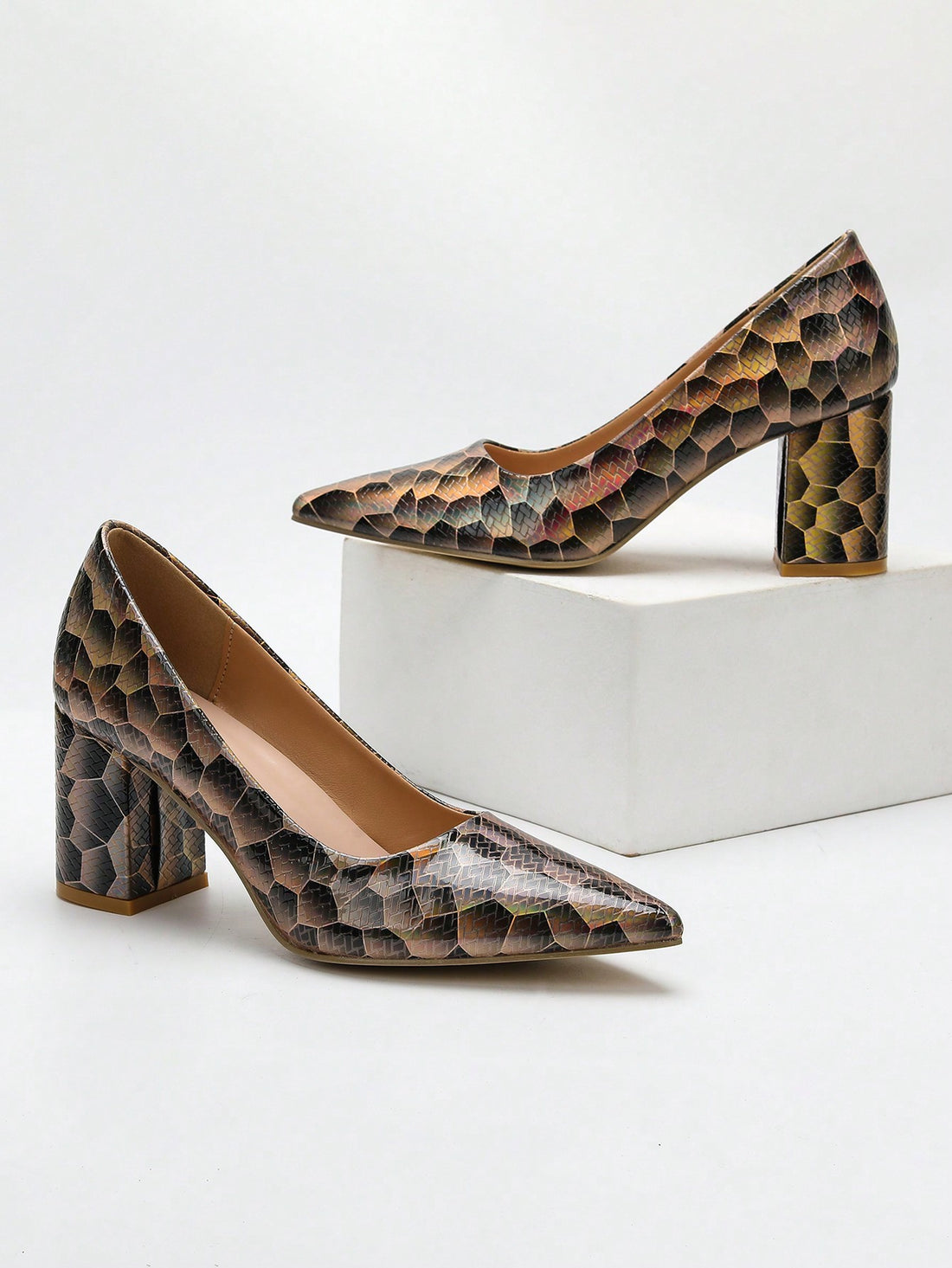 These Elegant Snake Pattern Pointed-Toe Pumps offer a perfect blend of style and comfort for the office. The snake pattern adds a touch of sophistication, while the pointed-toe design elongates the legs. With a comfortable high heel, you can confidently go from desk to dinner.