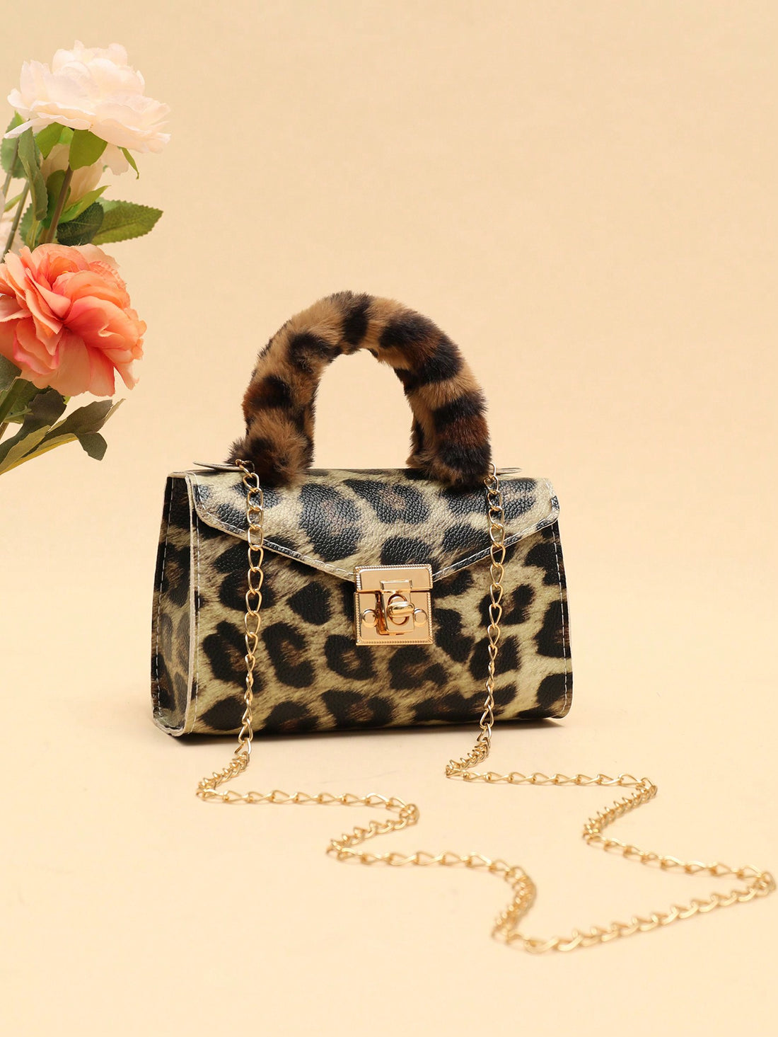 Stay stylish and warm this fall and winter with our Chic & Cozy Plush Chain Strap Crossbody Bag. Made with plush material and featuring a chain strap, this bag is both fashionable and functional. Keep your hands free while staying cozy on-the-go.