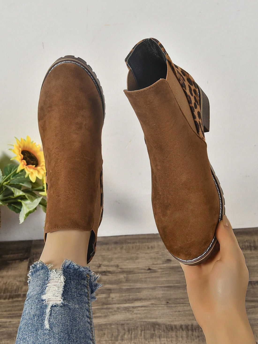 Elevate your style with our chic round toe Chelsea ankle boots. Crafted with comfort in mind, our boots feature a chunky low heel that provides stability and support. Perfect for any occasion, these boots will add a touch of sophistication to your wardrobe while keeping your feet happy.