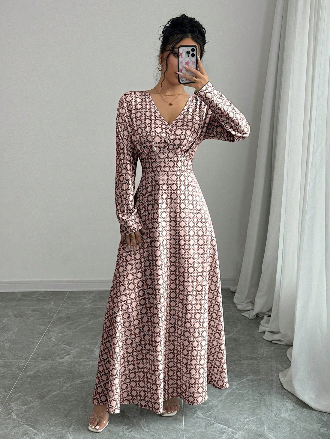 Get ready to make a statement with our Elegant All-Over Print V-Neck Maxi Dress! Perfect for spring and autumn fashion, this dress will have you turning heads with its stunning print and stylish V-neck. Embrace your inner fashionista and stand out from the crowd with this must-have dress.