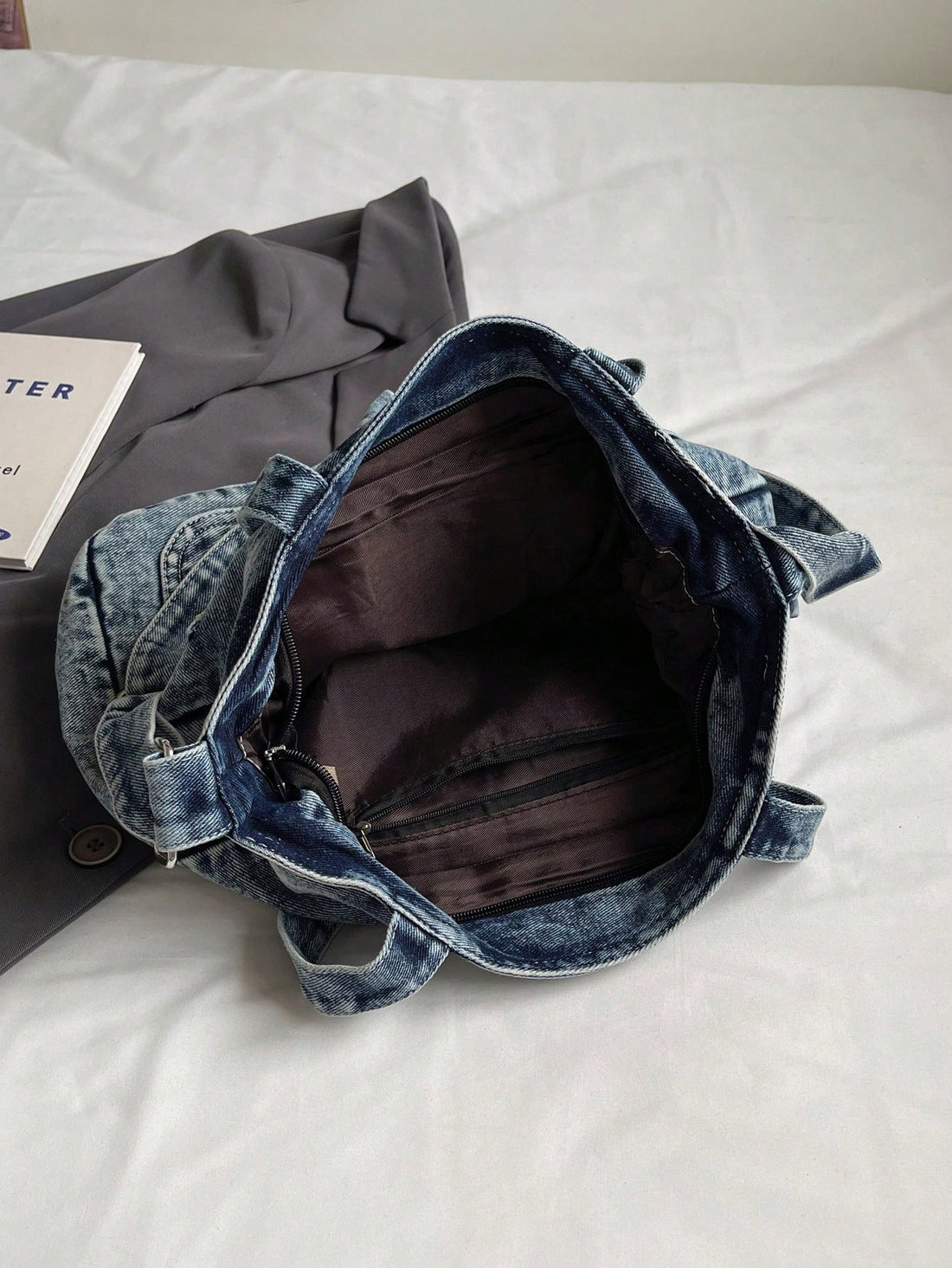 Discover the perfect blend of fashion and function with our Retro Chic Washed Jeans Tote Bag. Made from premium washed jeans, this stylish and durable tote features multiple pockets for easy organization, making it the ideal companion for school or commuting. Say goodbye to bulky bags and hello to effortless style and convenience.