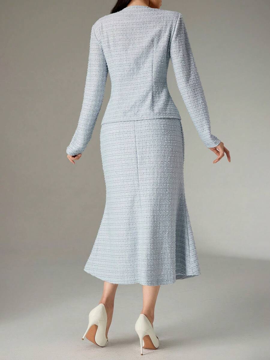 Embrace the season in style with this chic two-piece ensemble that's equal parts sophisticated and fun. The tailored solid-color jacket pairs perfectly with a graceful mermaid hem skirt, creating an effortlessly polished look for any autumn occasion. Whether you're heading to brunch, a dinner date, or a special event, this versatile set transitions seamlessly from day to night. The structured jacket adds a touch of elegance while the flowing skirt brings movement and flair. Perfect for anyone who loves time