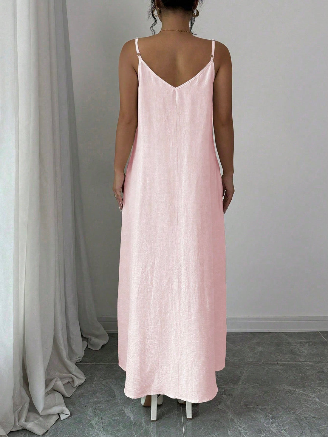 This adjustable strap maxi dress is both chic and versatile, making it a must-have for any wardrobe. Its loose and flare silhouette provides comfort and style for any occasion. Perfect for dressing up or down, this dress will surely become a staple in your closet.