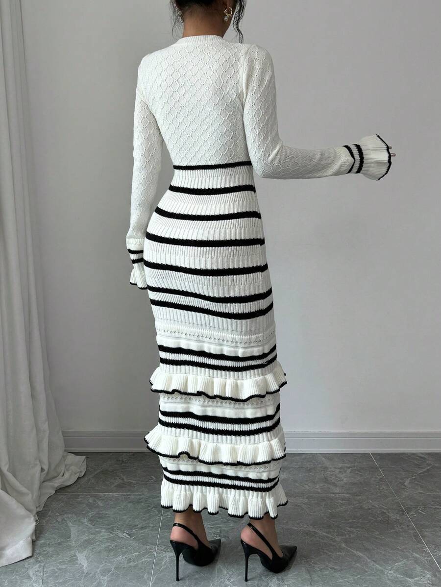 Black and white striped knit midi sweater dress with tiered ruffle hem, back view