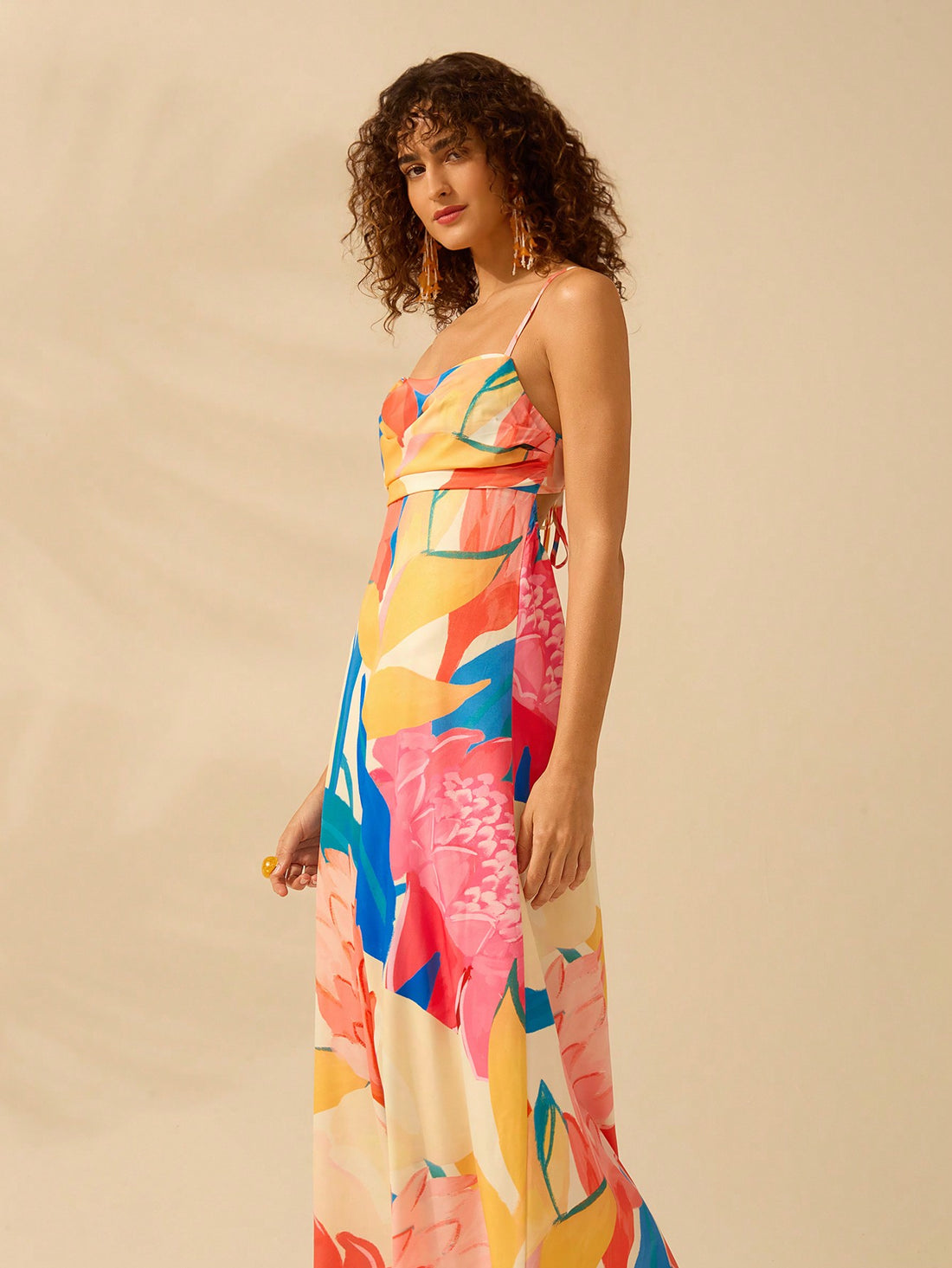 Effortlessly embrace summer style with our Boho Chic dress! Featuring a colorful tropical plant print and a sleeveless sling design, this dress is perfect for any sunny day. Say goodbye to the stress of putting together an outfit and hello to easy, breezy fashion!